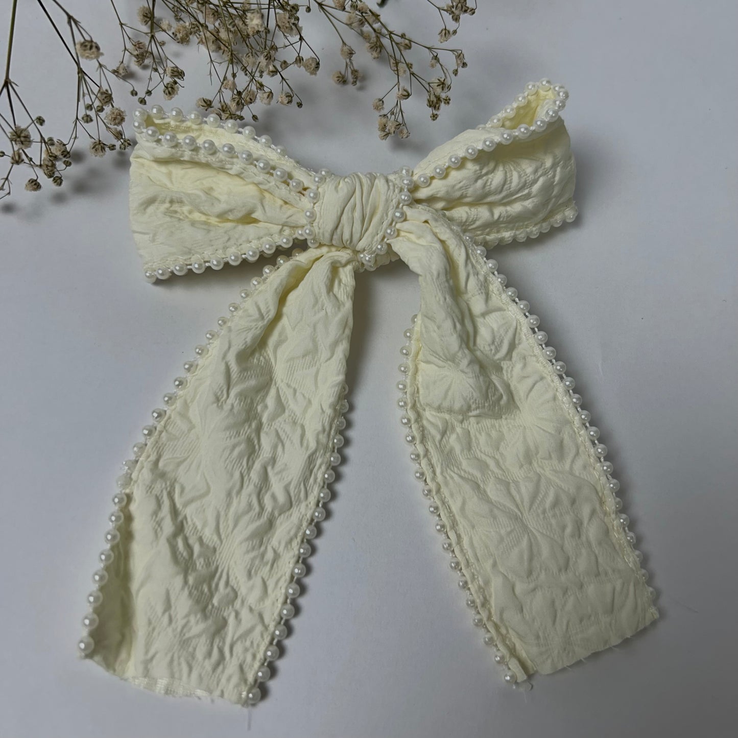 Off white bow with pearls