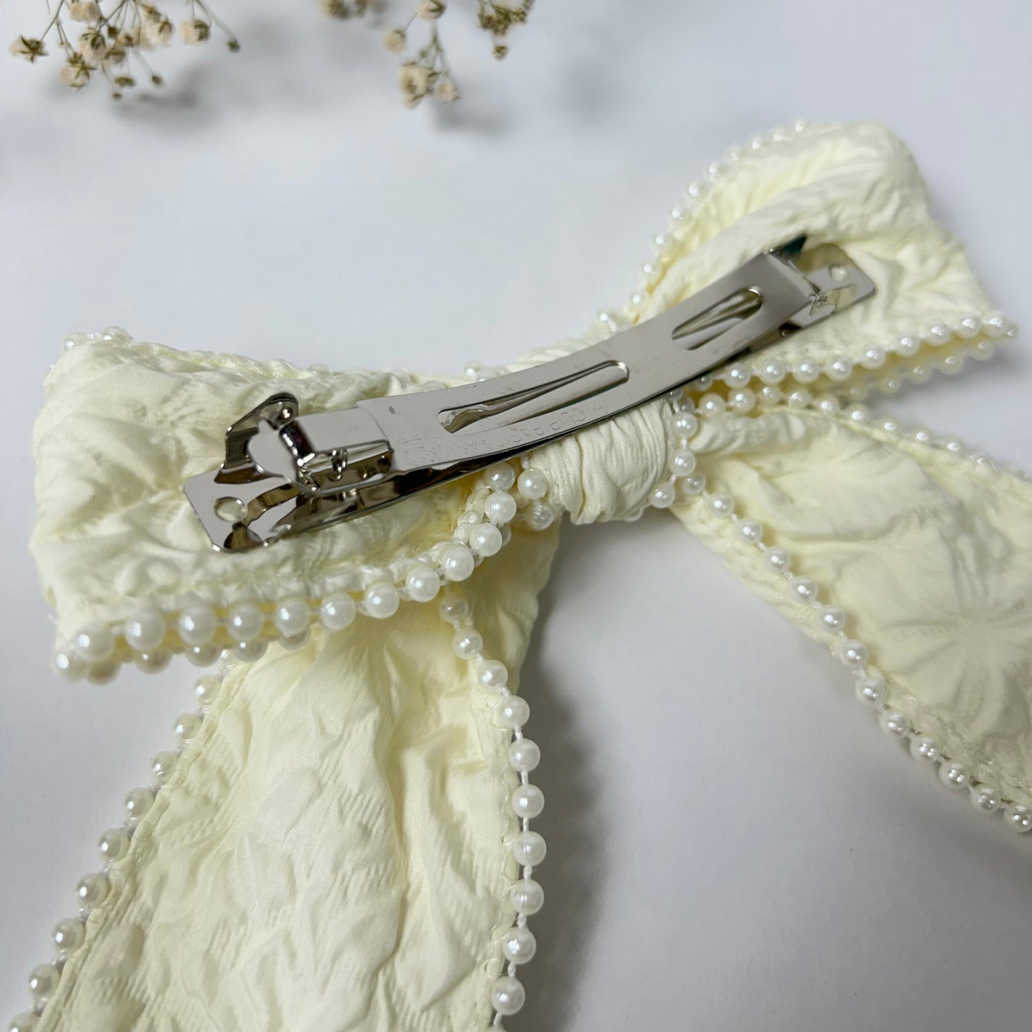 Off white bow with pearls